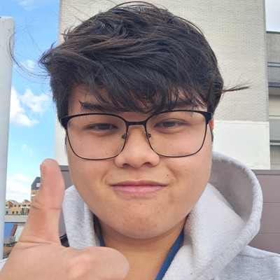 Picture of Daniel Tran holding his thumb up